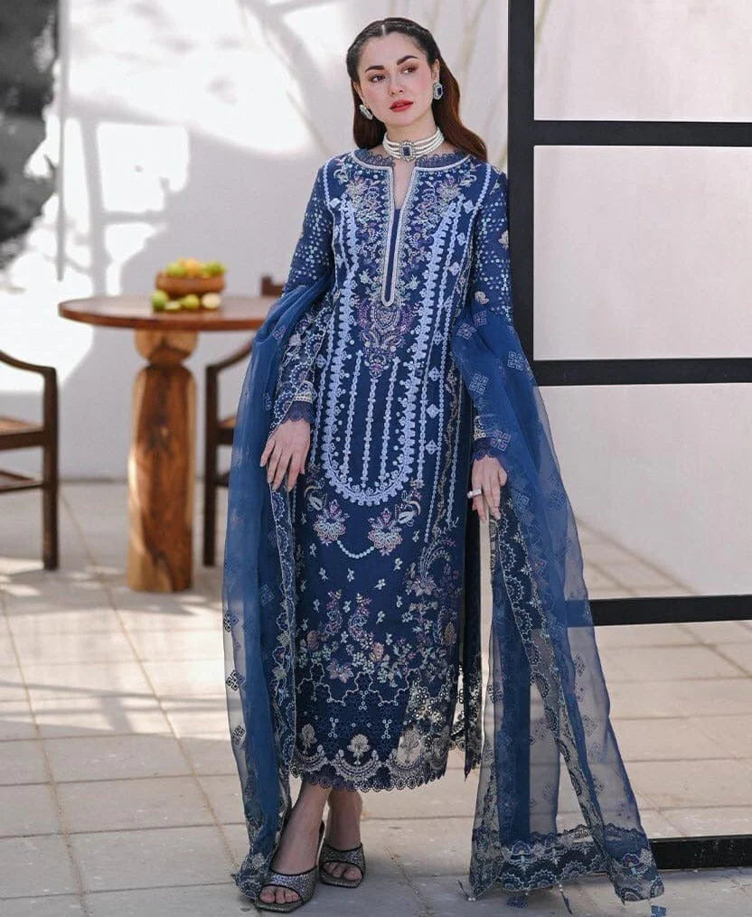 premium unstitched suit featuring a delicately embroidered lawn shirt, paired with a beautifully crafted embroidered organza dupatta and a matching trouser. Designed with elegance and comfort in mind, this outfit is perfect for festive gatherings, semi-formal events, and seasonal wear.